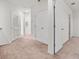 A hallway with carpet and multiple doors at 360 Arbor Lakes Dr, Davenport, FL 33896