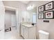 Bathroom featuring a single sink vanity with stone counter and tiled floor at 3926 Lana Ave, Davenport, FL 33897