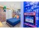 Bedroom decorated with superhero theme, bunkbeds, a mural, and colorful lighting at 3926 Lana Ave, Davenport, FL 33897