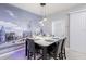 Charming dining area featuring a Disney mural and a modern light fixture above the marble table at 3926 Lana Ave, Davenport, FL 33897