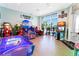 Brightly lit game room with arcade games and air hockey for hours of entertainment at 3926 Lana Ave, Davenport, FL 33897