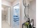 Hallway leading to the bathroom and bedroom with stylish decor at 3926 Lana Ave, Davenport, FL 33897