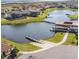 Aerial view of a waterfront community with lake, boat docks, and residential homes at 4119 Bella Isle Cir, Kissimmee, FL 34746