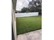 Fenced backyard with green lawn at 4119 Bella Isle Cir, Kissimmee, FL 34746