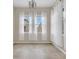 Dining Room: Ample natural light and decorative chandelier at 486 Windmill Palm Cir, Altamonte Springs, FL 32701