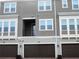 Exterior view of townhome with a garage and upper level balcony at 486 Windmill Palm Cir, Altamonte Springs, FL 32701