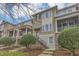 Charming townhome with a brick facade, covered porch, and well-maintained landscaping at 486 Windmill Palm Cir, Altamonte Springs, FL 32701