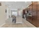 Spacious kitchen with dark wood cabinets, granite countertops, and stainless steel appliances at 486 Windmill Palm Cir, Altamonte Springs, FL 32701