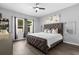 Cozy bedroom with a plush tufted headboard bed, natural light, and neutral tones at 4860 Osprey Way, Winter Haven, FL 33881