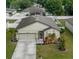 Charming single-story home featuring a well-maintained lawn and attached two-car garage at 4860 Osprey Way, Winter Haven, FL 33881