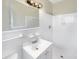 Bright bathroom with a tiled shower, vanity, and updated lighting at 5404 Milan Dr, Orlando, FL 32810