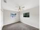 Bedroom featuring natural light, ceiling fan, and cozy carpet at 5404 Milan Dr, Orlando, FL 32810