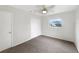 Bright bedroom featuring a closet, ceiling fan and large window at 5404 Milan Dr, Orlando, FL 32810