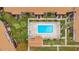 Aerial view of a community pool surrounded by condos, lawns and landscaping at 5405 Hansel Ave # G9, Orlando, FL 32809