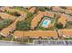 Aerial view of the condo complex with a pool and well-manicured landscaping and parking at 5405 Hansel Ave # G9, Orlando, FL 32809