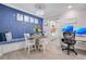 Stylish dining area features a custom blue banquette, modern lighting, and a decorative tablescape at 5405 Hansel Ave # G9, Orlando, FL 32809