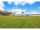 Spacious green lawn leading to the lake, perfect for recreation and relaxation at 5405 Hansel Ave # G9, Orlando, FL 32809