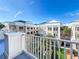 Balcony view overlooking a courtyard with lush tropical landscaping and community buildings at 580 Water St # F, Kissimmee, FL 34747