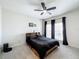 A cozy bedroom featuring a ceiling fan, neutral paint, and lots of natural light at 580 Water St # F, Kissimmee, FL 34747