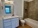 Renovated bathroom with sleek vanity, new fixtures, and modern tile work around the tub and shower at 583 Brantley Terrace Way # 303, Altamonte Springs, FL 32714