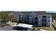 Modern apartment complex with ample parking including covered spaces and accessible parking near the building at 583 Brantley Terrace Way # 303, Altamonte Springs, FL 32714