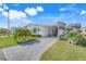 Charming single-story home with well-manicured lawn and patterned concrete driveway at 6302 Bayberry Ne Blvd, Winter Haven, FL 33881