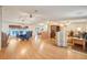 Spacious living room flowing into dining area, featuring hardwood floors at 6302 Bayberry Ne Blvd, Winter Haven, FL 33881