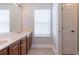 Bathroom features double sink vanity with granite counters and tiled floor at 6825 Dolce St, Orlando, FL 32819