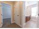 Hallway leading to the bathroom featuring double sinks and tiled flooring at 6825 Dolce St, Orlando, FL 32819