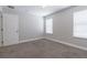 Bright bedroom with neutral walls, carpet flooring, and natural light at 6825 Dolce St, Orlando, FL 32819