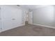 Bedroom featuring neutral walls, carpet, and double closet doors at 6825 Dolce St, Orlando, FL 32819