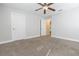 Bedroom features neutral carpet and ceiling fan at 6825 Dolce St, Orlando, FL 32819