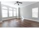 Bright bedroom with hardwood floors and large windows at 6825 Dolce St, Orlando, FL 32819