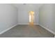 Bedroom with vaulted ceiling, carpeted floor, and natural lighting at 6825 Dolce St, Orlando, FL 32819