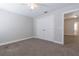 Bedroom with neutral walls, carpet, closet, ceiling fan, and ample natural light at 6825 Dolce St, Orlando, FL 32819