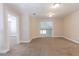 Bonus room with neutral walls, carpeted floors, and natural light at 6825 Dolce St, Orlando, FL 32819