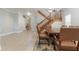Inviting dining room adjacent to the staircase with a view into another room at 6825 Dolce St, Orlando, FL 32819