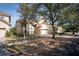 View of charming 2-story house, front yard and street at 6825 Dolce St, Orlando, FL 32819