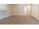 Spacious hallway with neutral walls and carpet flooring leads to additional rooms at 6825 Dolce St, Orlando, FL 32819