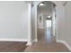 Bright hallway featuring tile flooring, arched doorways, and decorative columns at 6825 Dolce St, Orlando, FL 32819