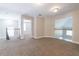 Upstairs hallway with carpet flooring and railing overlooks additional living spaces at 6825 Dolce St, Orlando, FL 32819