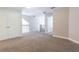 Open hallway with carpet floors and a railing offers access to other areas of the home at 6825 Dolce St, Orlando, FL 32819