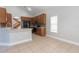 Well-lit kitchen featuring tile floors, wood cabinets, and stainless steel appliances at 6825 Dolce St, Orlando, FL 32819