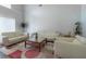 Bright living room featuring modern sofas, hardwood floors, high ceilings and stylish decor at 6825 Dolce St, Orlando, FL 32819