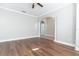 Bright living room with hardwood floors and an arched doorway at 6825 Dolce St, Orlando, FL 32819