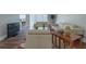 Bright living room featuring modern sofas, hardwood floors, and stylish decor at 6825 Dolce St, Orlando, FL 32819