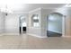 Bright living room boasts tile flooring, arched entries, and large windows allowing natural light to fill the space at 6825 Dolce St, Orlando, FL 32819