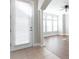 Bright living room features wood floors, an elegant archway, and large windows that bring in tons of natural light at 6825 Dolce St, Orlando, FL 32819