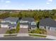 An aerial view of the neighborhood with nearby skyline and trees at 8309 Park Cliff Way, Orlando, FL 32836