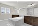 Bright bathroom featuring double vanity sinks and a luxurious soaking tub at 8309 Park Cliff Way, Orlando, FL 32836